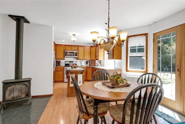 a view of a dining room with furniture window and outside view