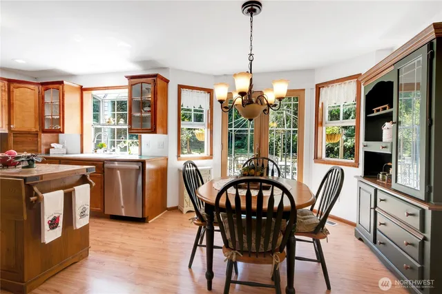 a view of a dining room with furniture window and outside view
