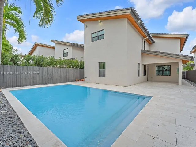 a view of outdoor space and swimming pool