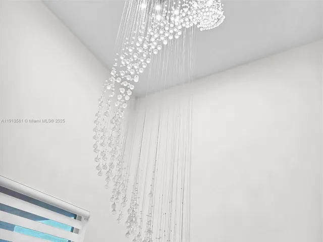 a view of a hallway with stairs and wooden floor