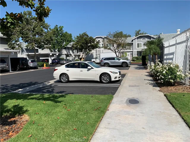a view of a car parked in front of a house