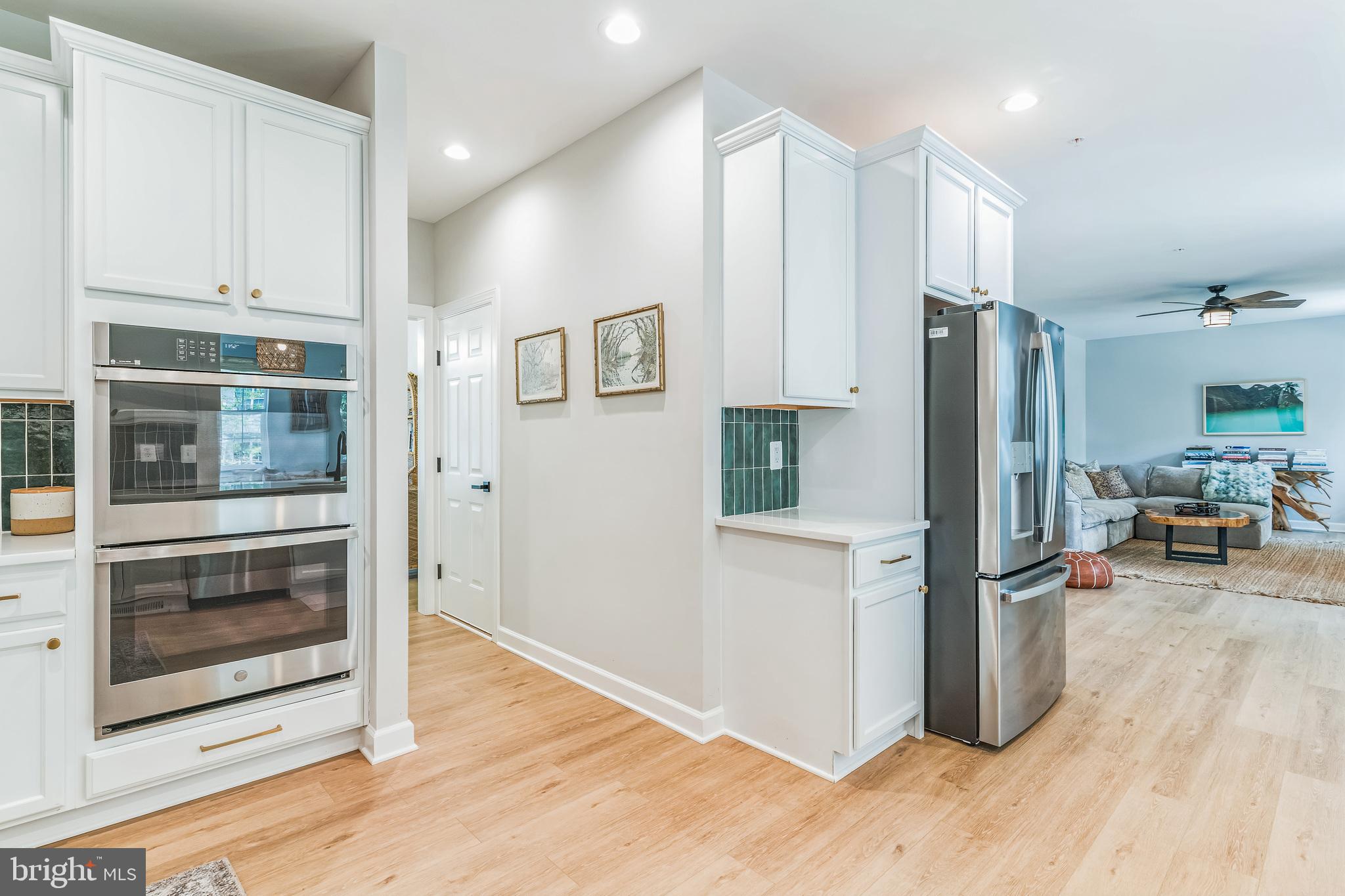 14720 Locust Court Issue, MD 20645 - Photo 11 of 41 a kitchen with stainless steel appliances a refrigerator and wooden floor