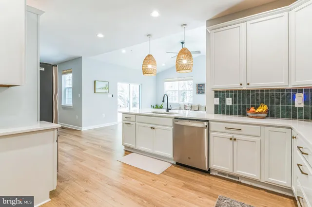 a kitchen with a sink cabinets and window