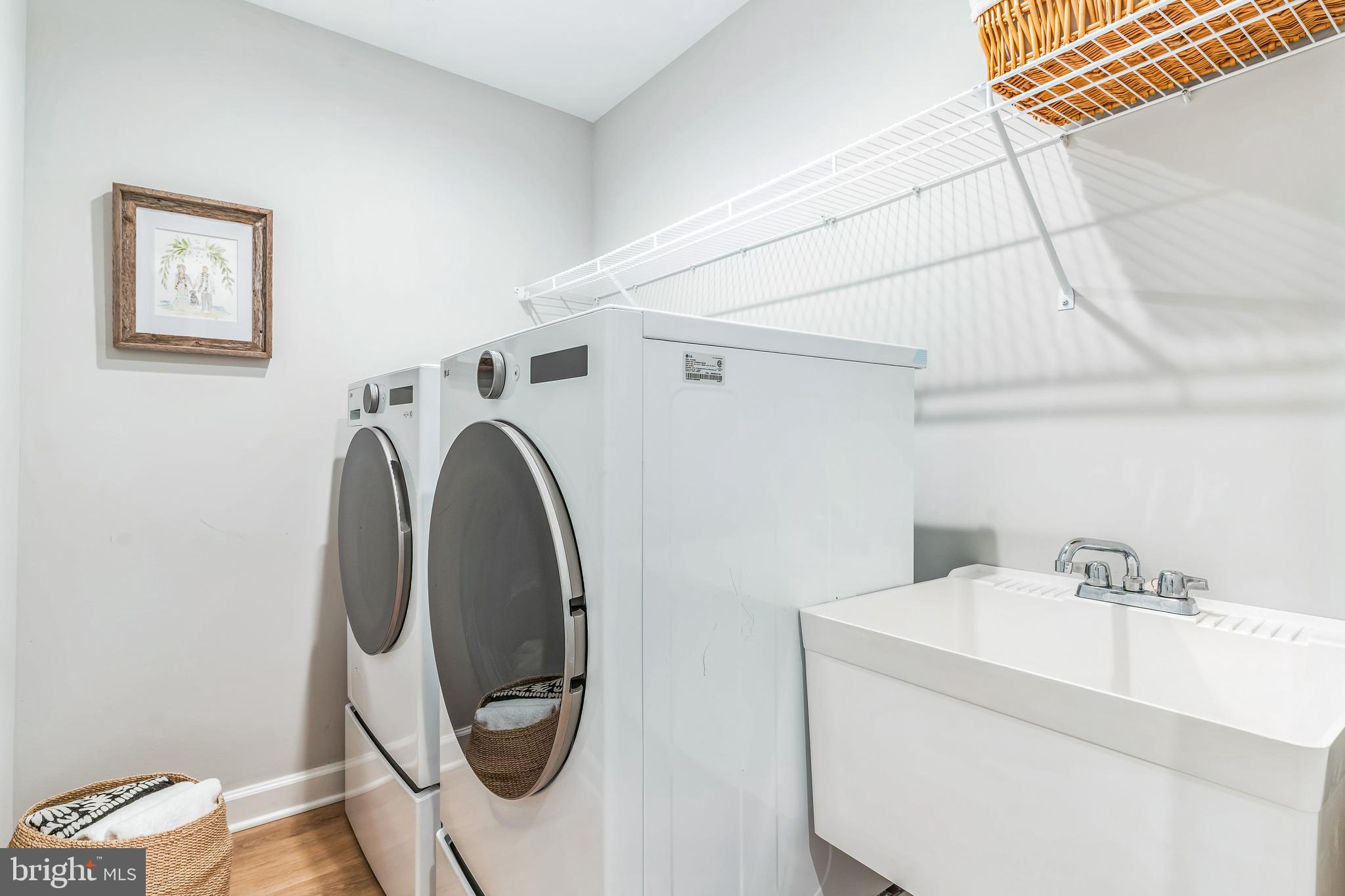 14720 Locust Court Issue, MD 20645 - Photo 24 of 41 a utility room with dryer and washer