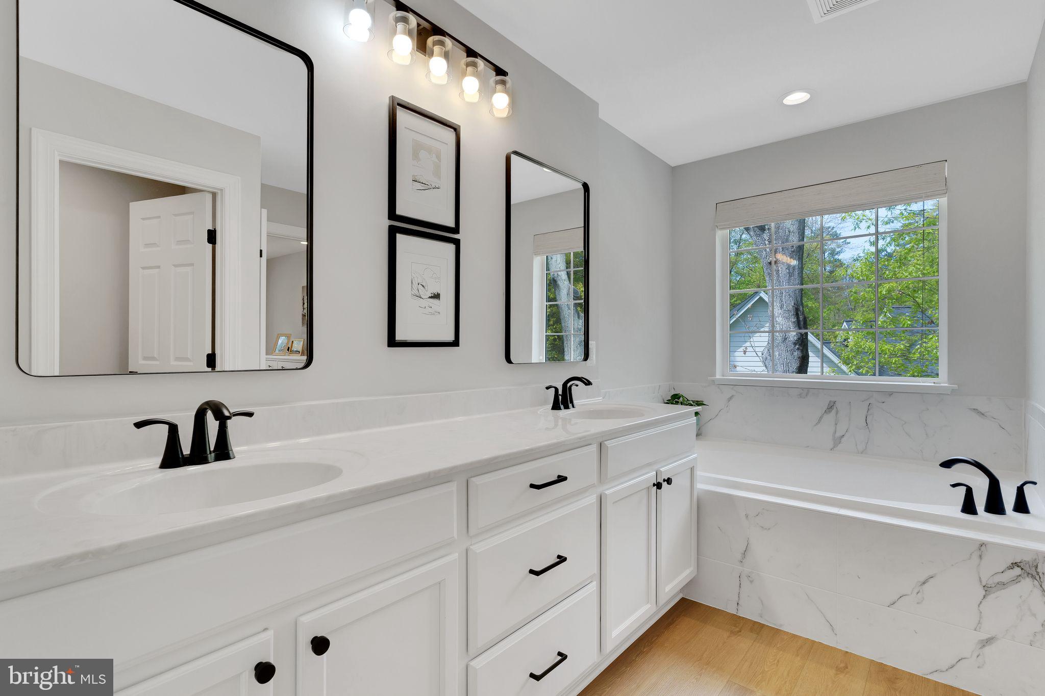 14720 Locust Court Issue, MD 20645 - Photo 27 of 41 a bathroom with a tub a sink and a window