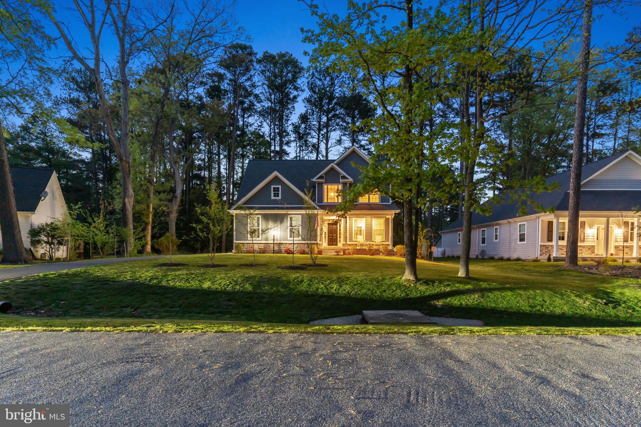 14720 Locust Court Issue, MD 20645 - Photo 41 of 42 a front view of a house with a yard and garage