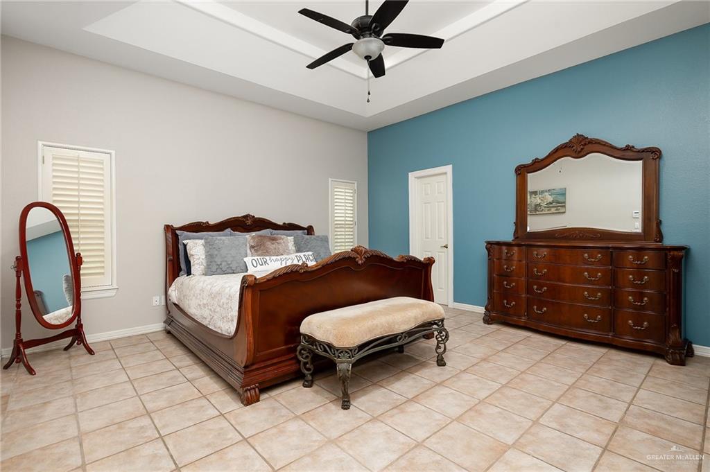 5344 East Mile 4 Road Mission, TX 78573 - Photo 11 of 22 a bedroom with a bed and a dresser