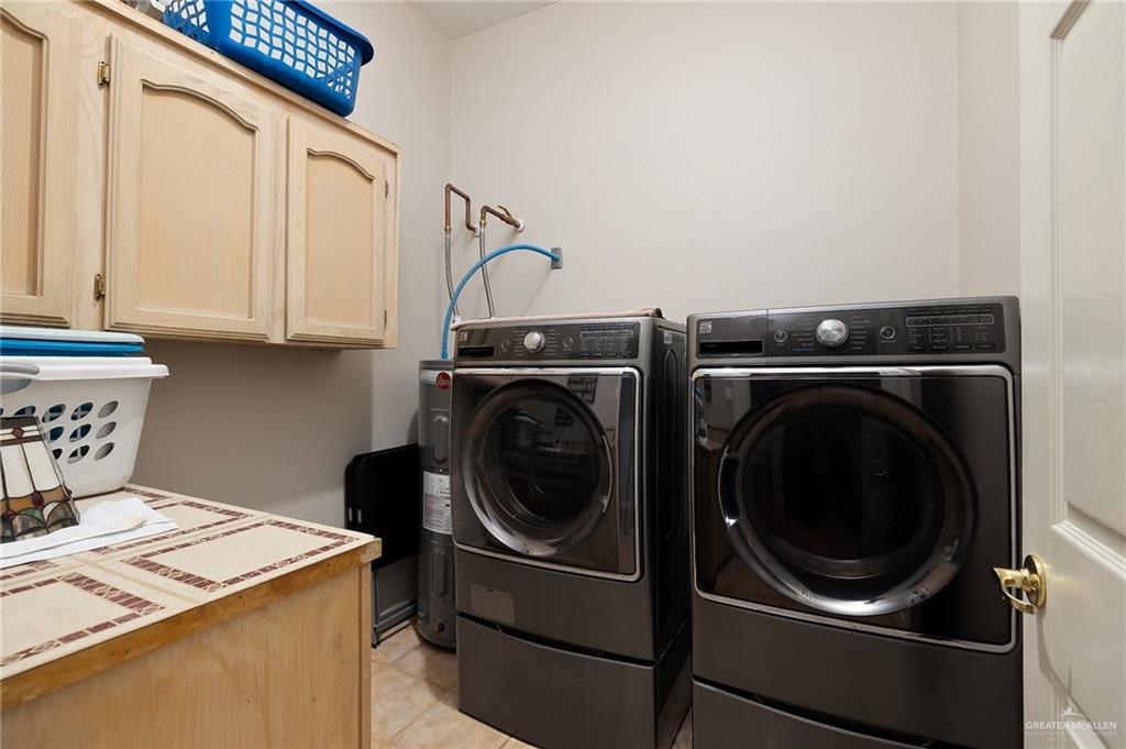 5344 East Mile 4 Road Mission, TX 78573 - Photo 16 of 22 a utility room with dryer and washer