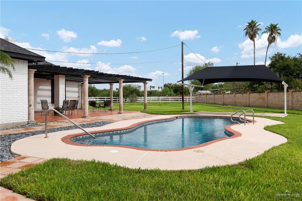 5344 East Mile 4 Road Mission, TX 78573 - Photo 21 of 22 a view of a backyard with a swimming pool
