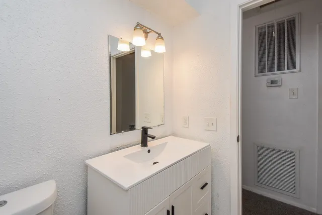 a utility room with a sink dryer and washer
