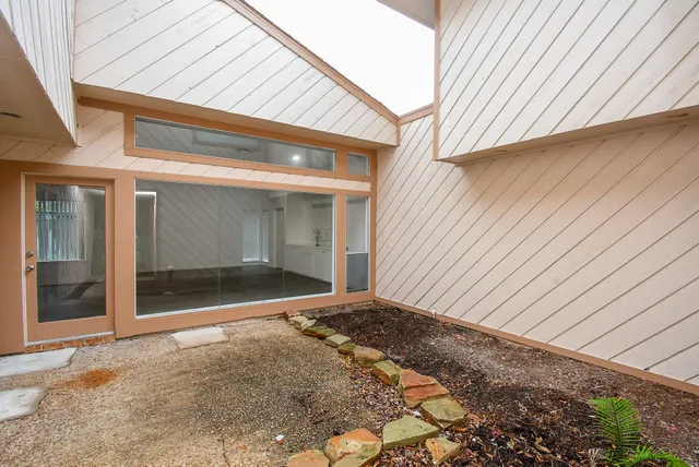 a view of backyard with garage