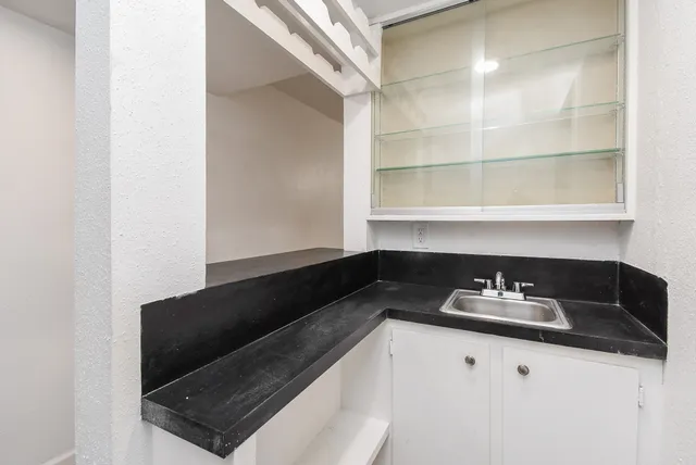 a close view of shoes stand and cabinets