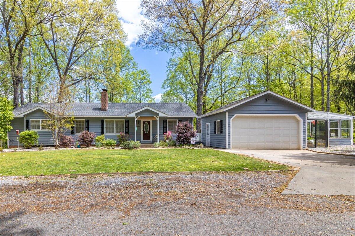 264 Pine Knob Circle Moneta, VA 24121 - Photo 1 of 67 a front view of a house with a yard and trees