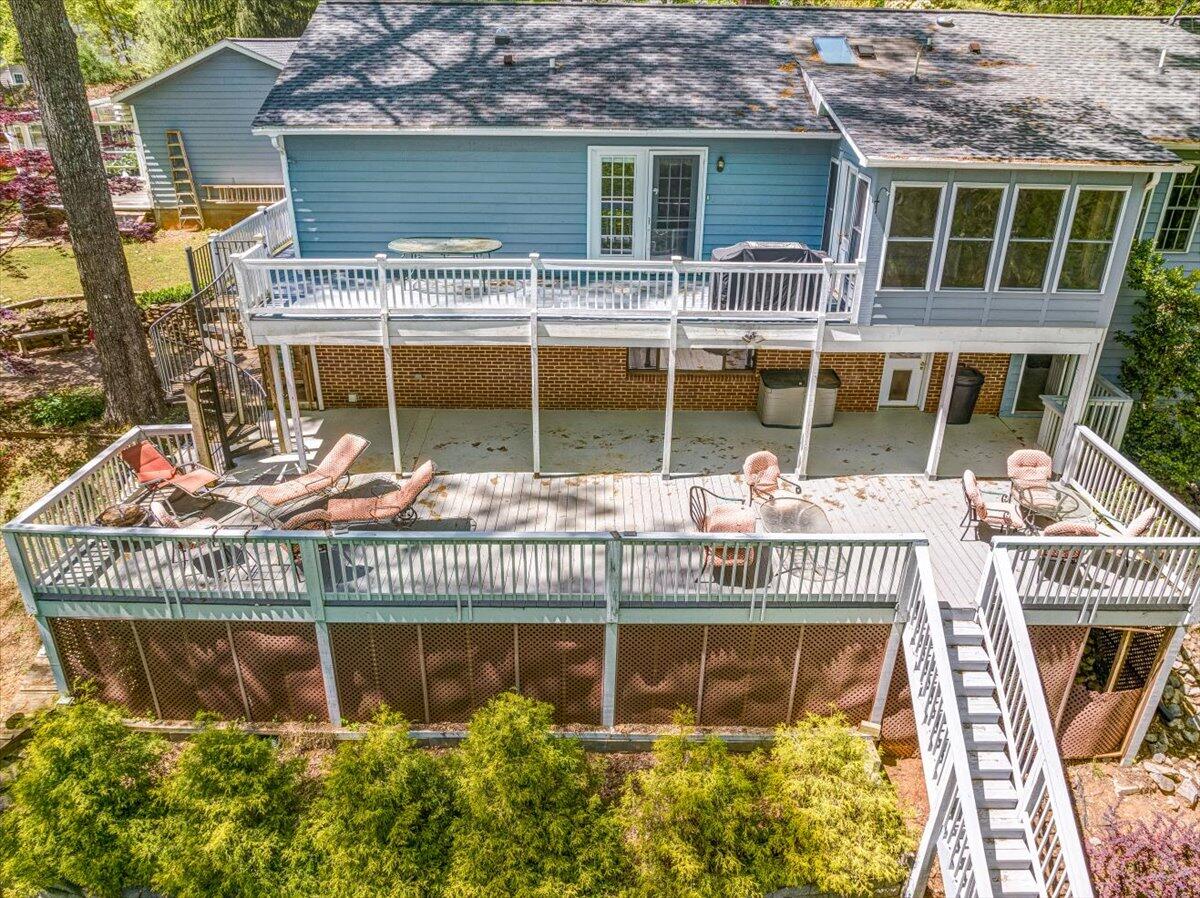 264 Pine Knob Circle Moneta, VA 24121 - Photo 12 of 67 a front view of a house with a yard glass top table and chairs