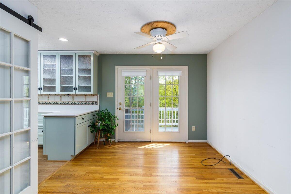 264 Pine Knob Circle Moneta, VA 24121 - Photo 18 of 67 wooden floor in an empty room with a window