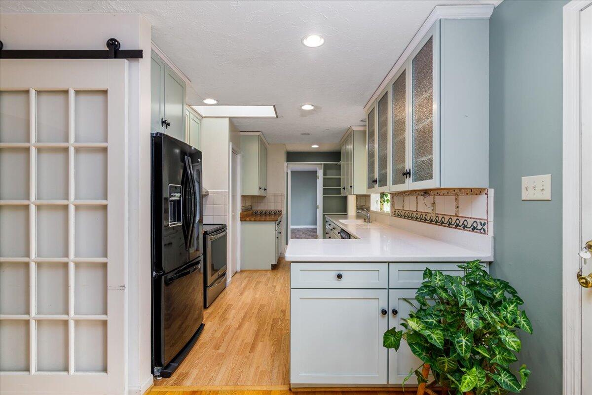 264 Pine Knob Circle Moneta, VA 24121 - Photo 20 of 67 a view of kitchen with stainless steel appliances kitchen island granite countertop a refrigerator and a sink