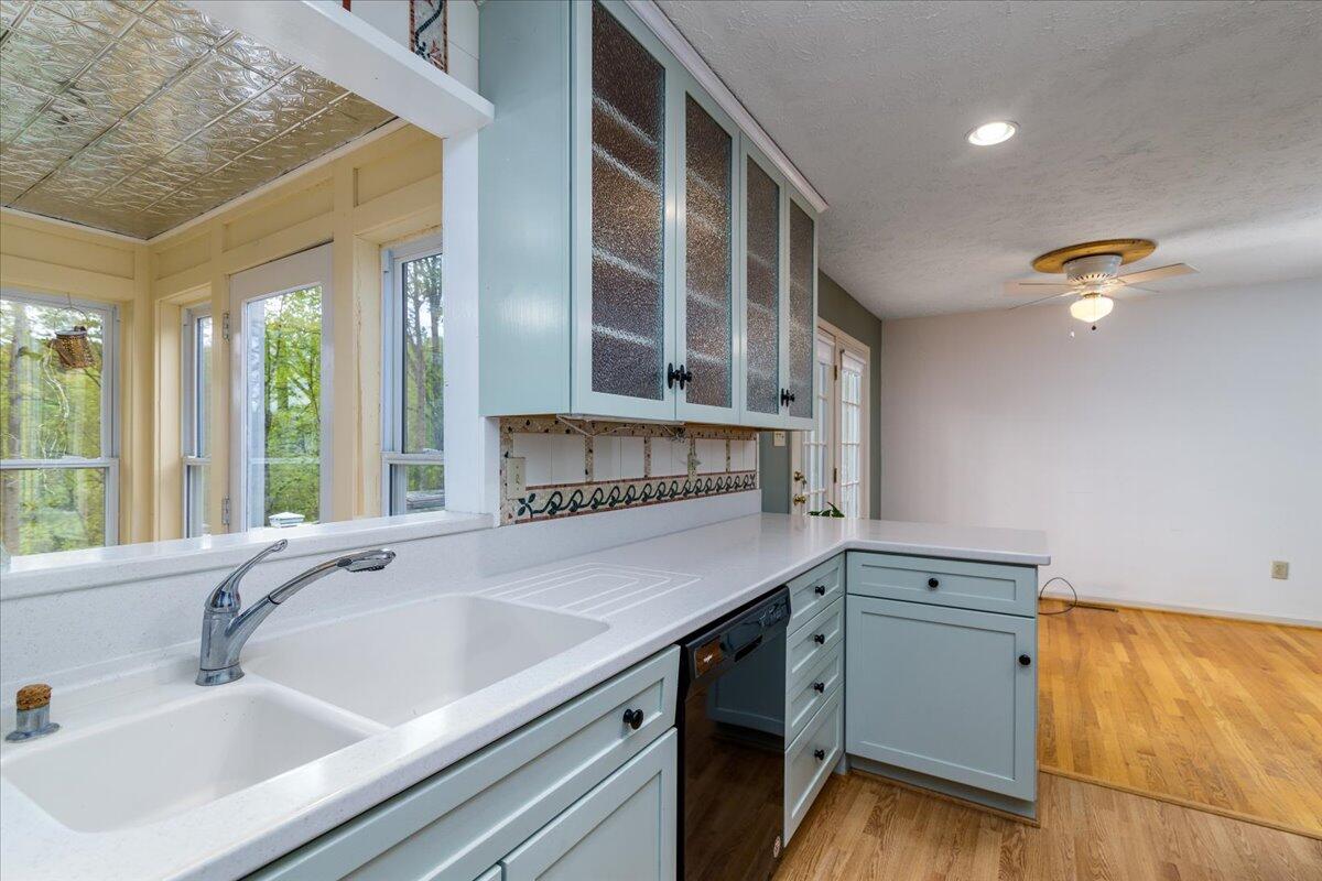 264 Pine Knob Circle Moneta, VA 24121 - Photo 22 of 67 a kitchen with a sink and wooden cabinets