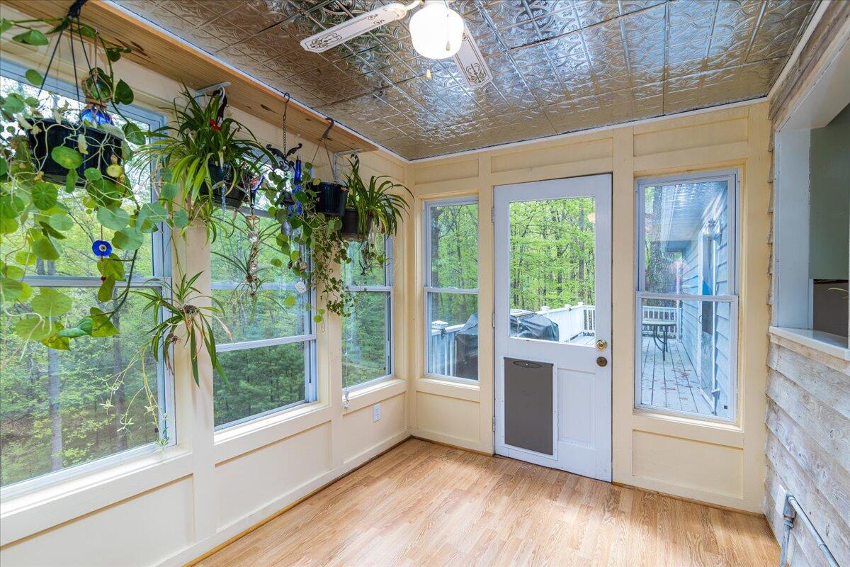 264 Pine Knob Circle Moneta, VA 24121 - Photo 25 of 67 a view of an empty room with a window and a potted plant