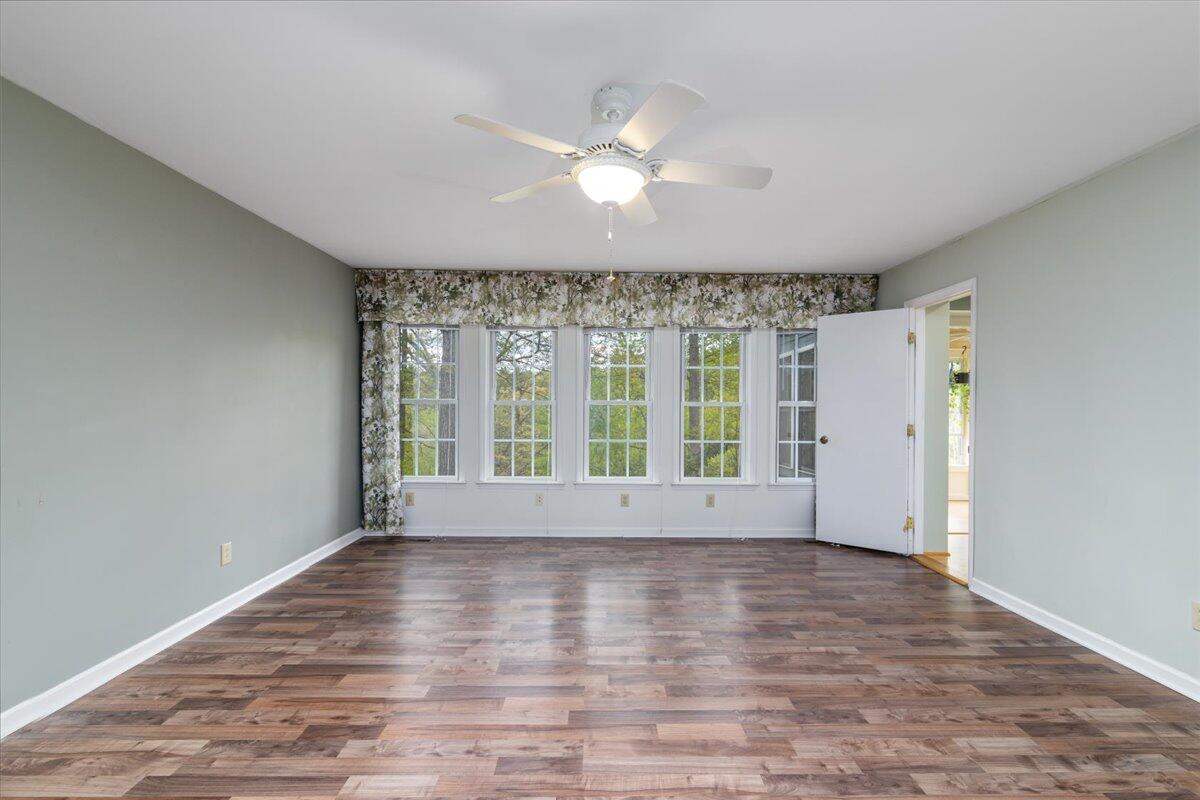 264 Pine Knob Circle Moneta, VA 24121 - Photo 27 of 67 a view of an empty room with wooden floor and a window
