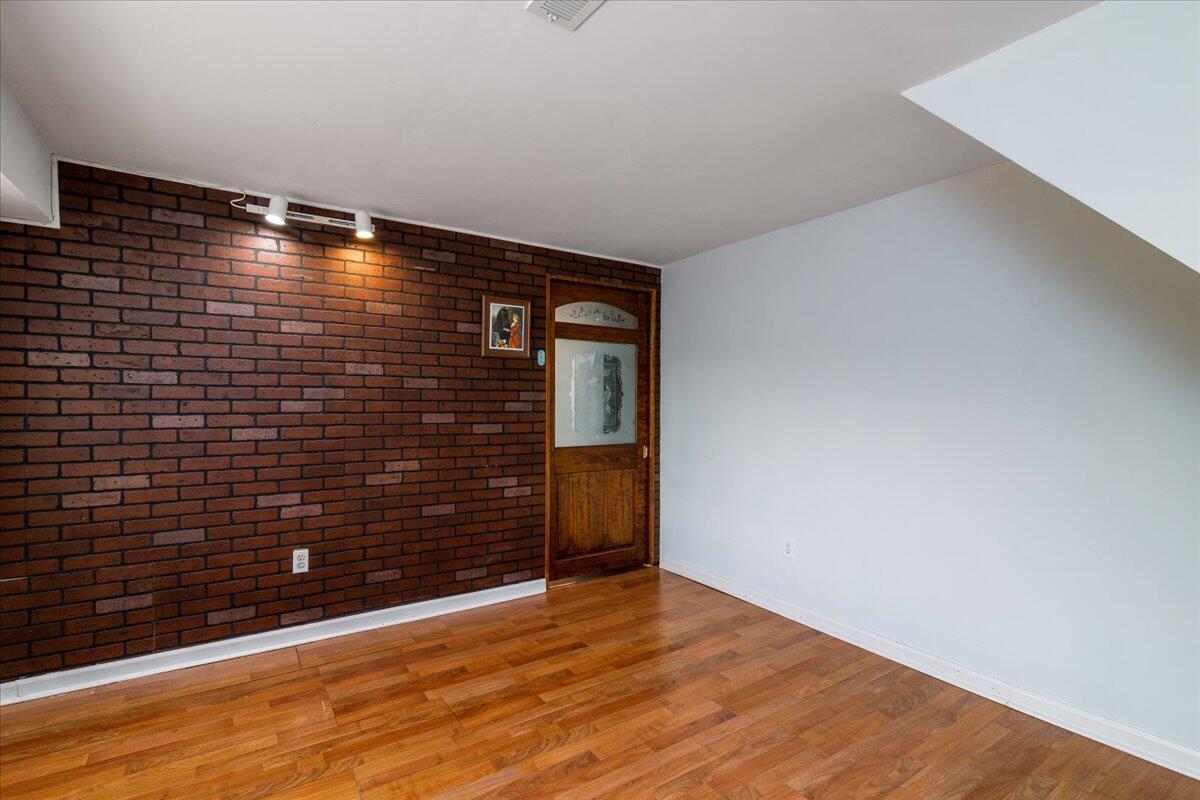 264 Pine Knob Circle Moneta, VA 24121 - Photo 39 of 67 a view of an empty room with wooden floor and a window