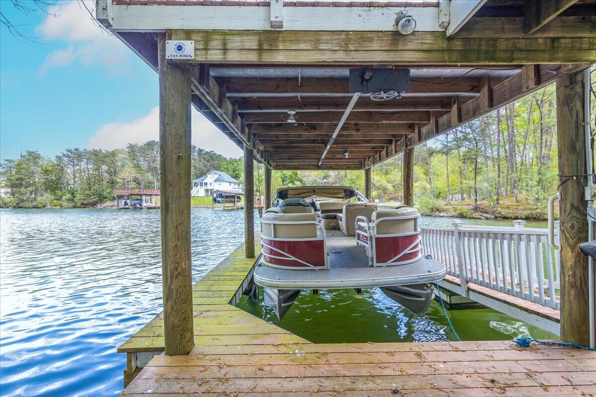 264 Pine Knob Circle Moneta, VA 24121 - Photo 54 of 67 a view of a patio with a table chairs and wooden floor