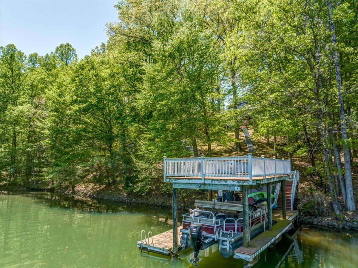 264 Pine Knob Circle Moneta, VA 24121 - Photo 59 of 67 a view of house with swimming pool and trees in the background