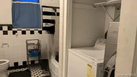a utility room with dryer and washer