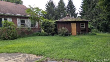 22 Old Mill Road Poughkeepsie, NY 12603 - Photo 13 of 18 a front view of a house with garden
