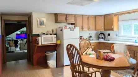 a kitchen with a table and chairs in it