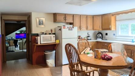 22 Old Mill Road Poughkeepsie, NY 12603 - Photo 14 of 18 a kitchen with a table and chairs in it