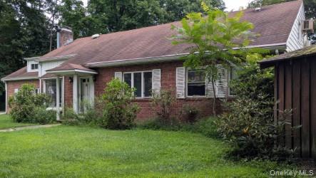 22 Old Mill Road Poughkeepsie, NY 12603 - Photo 2 of 18 a front view of a house with a yard