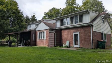 22 Old Mill Road Poughkeepsie, NY 12603 - Photo 4 of 18 a front view of a house with a garden