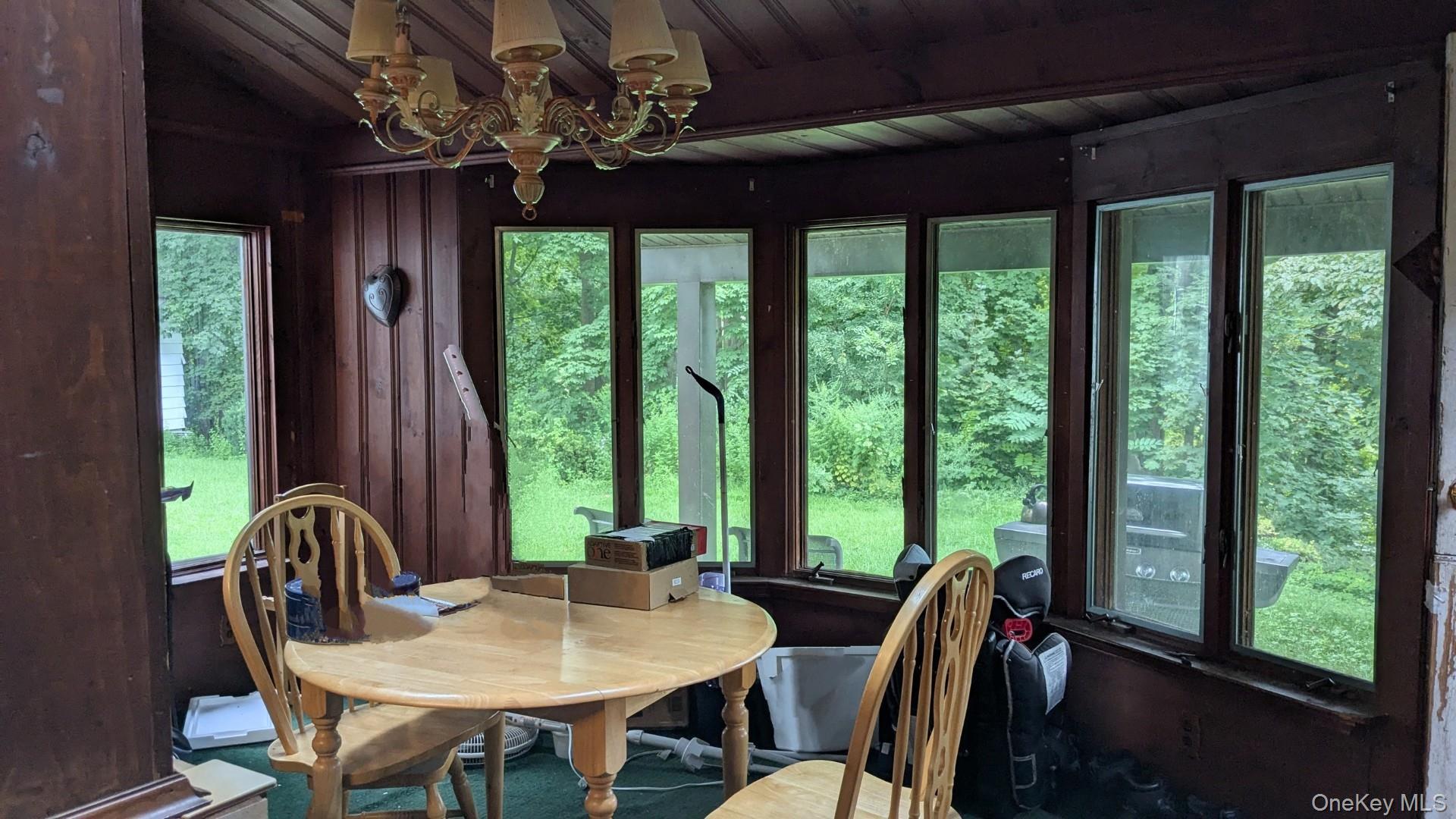 22 Old Mill Road Poughkeepsie, NY 12603 - Photo 9 of 18 a view of a dining room with furniture window and outside view