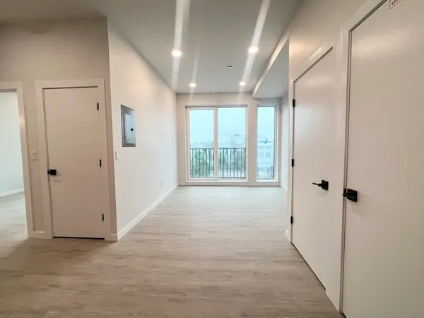 a view of an empty room with a window