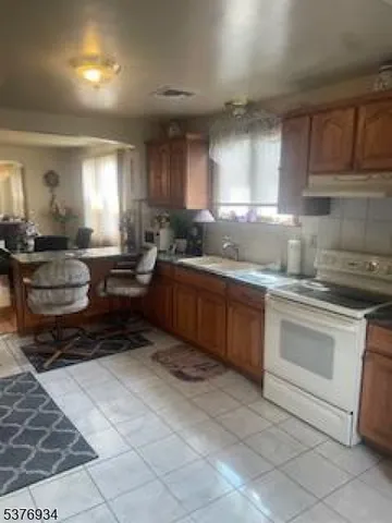 a kitchen with lots of counter top space and appliances