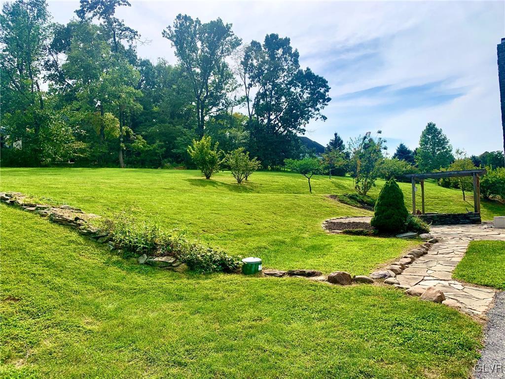 235 Valley View Road Hellertown, PA 18055 - Photo 8 of 41 a view of a golf course with a lake