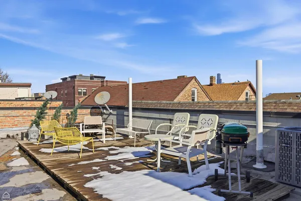 a view of a chairs and table on the terrace