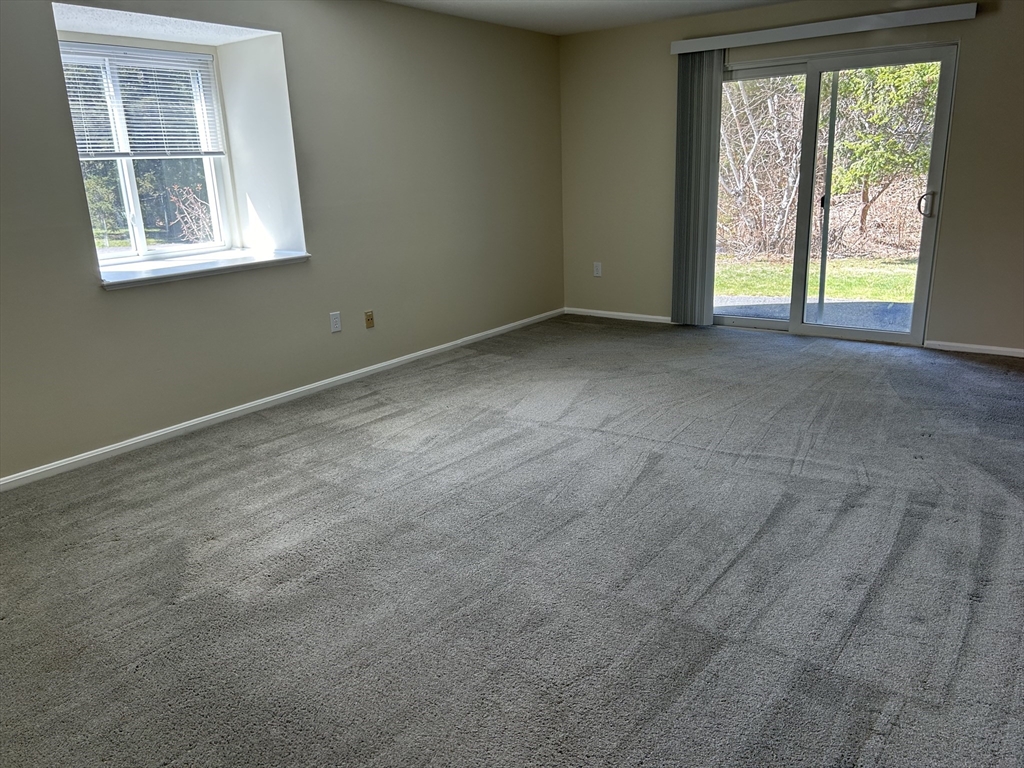20 Beal's Cove Road, Unit A Hingham, MA 02043 - Photo 3 of 7 an empty room with windows