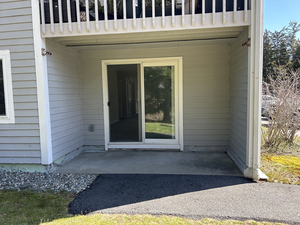 20 Beal's Cove Road, Unit A Hingham, MA 02043 - Photo 6 of 7 a front view of a house with a yard