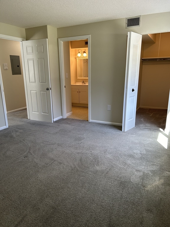 20 Beal's Cove Road, Unit A Hingham, MA 02043 - Photo 7 of 7 an empty room with closet and mirror