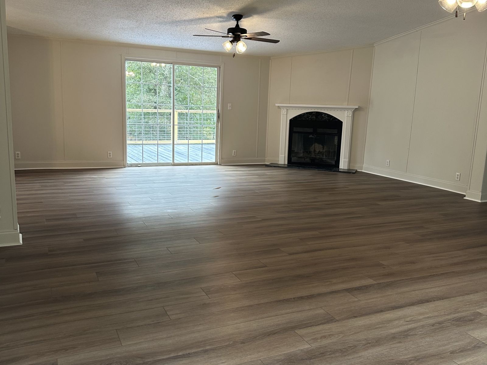 75 David Box Road Darden, TN 38328 - Photo 3 of 10 a view of a livingroom with wooden floor a ceiling fan and a window