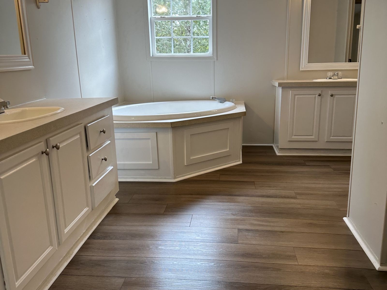 75 David Box Road Darden, TN 38328 - Photo 4 of 10 a utility room with cabinets and wooden floor
