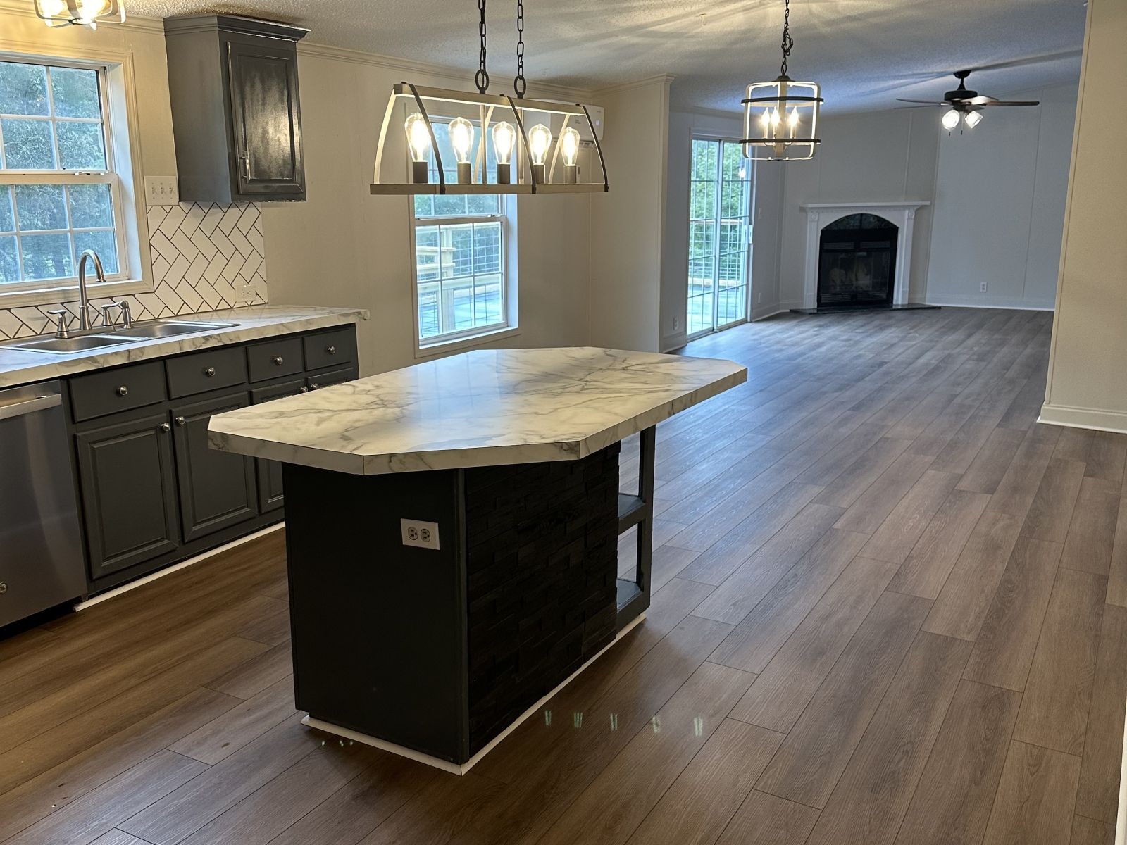 75 David Box Road Darden, TN 38328 - Photo 8 of 10 a kitchen with a sink and chandelier