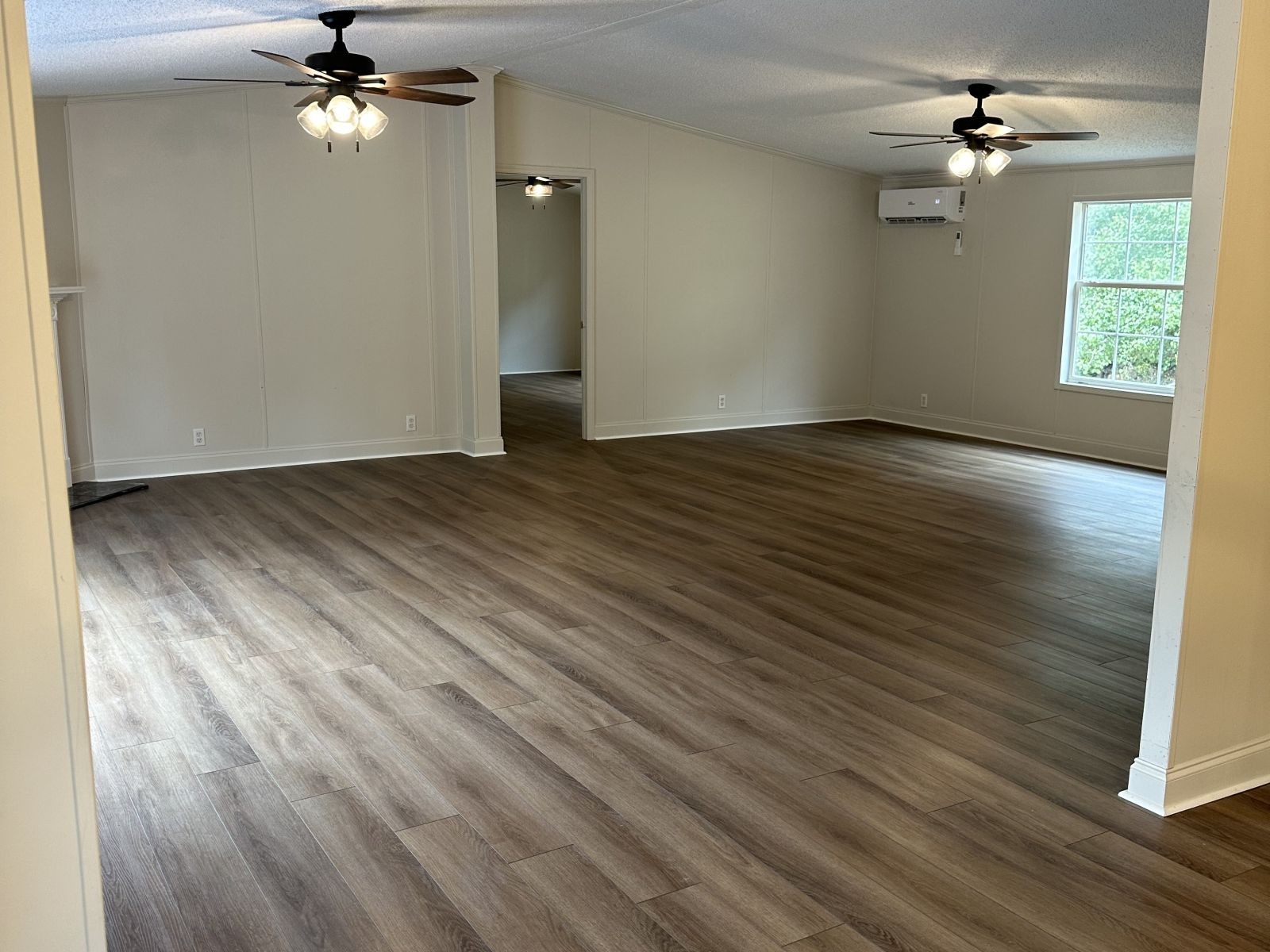 75 David Box Road Darden, TN 38328 - Photo 9 of 10 wooden floor in an empty room with a window