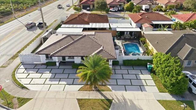 an aerial view of a house with a garden