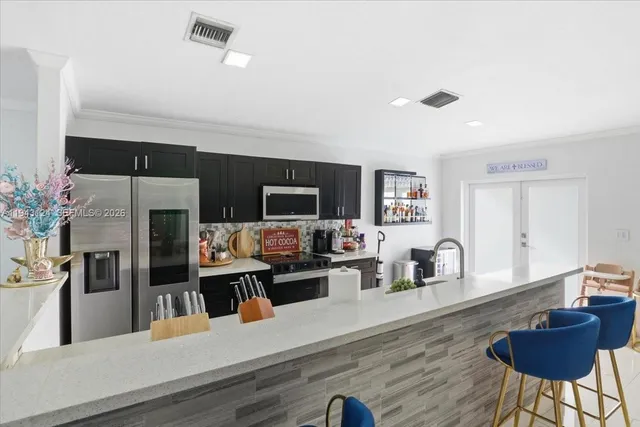 a living room with furniture wooden floor and a flat screen tv