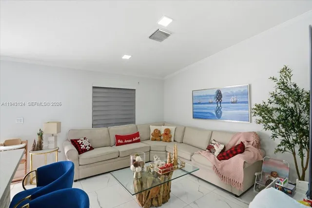 a living room with furniture and a couch