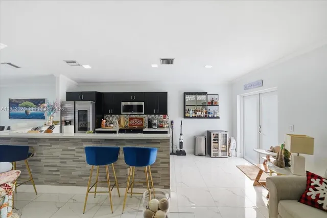 a kitchen with a cabinets and chairs