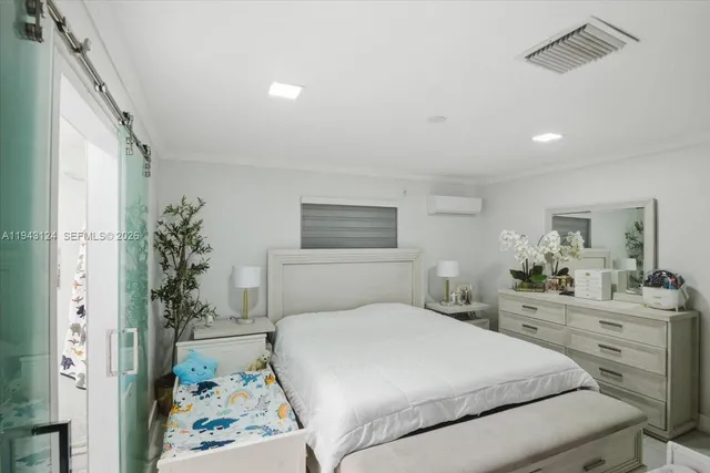 a bedroom with a bed and a couch