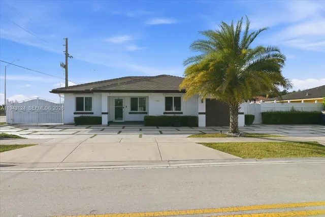 a front view of a house with swimming pool and porch